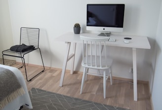 white wooden table with black flat screen tv