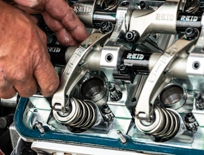 a close up of a person working on a machine